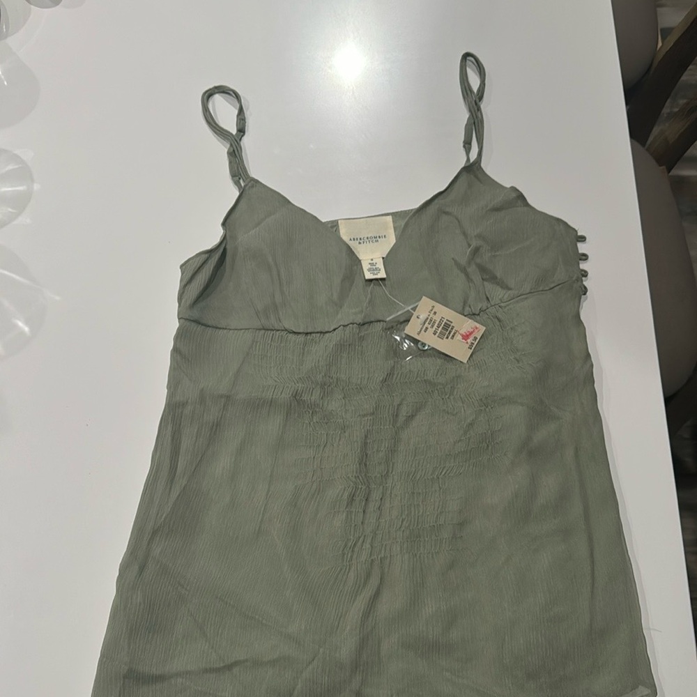 Light green top with original tag! 100% silk